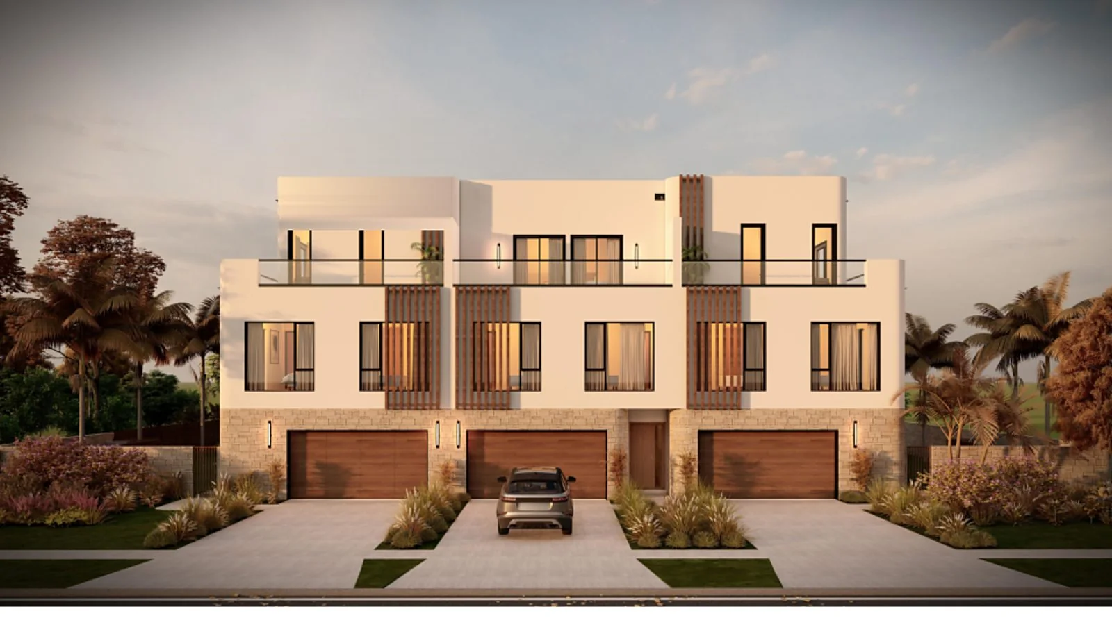 Rendering of the three printed townhomes seen from the street, with garages and roof terraces
