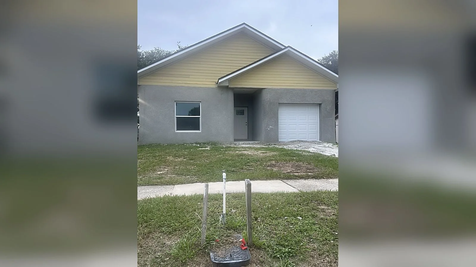 The finished 4426 Lurline home from the street, stucco and siding complete